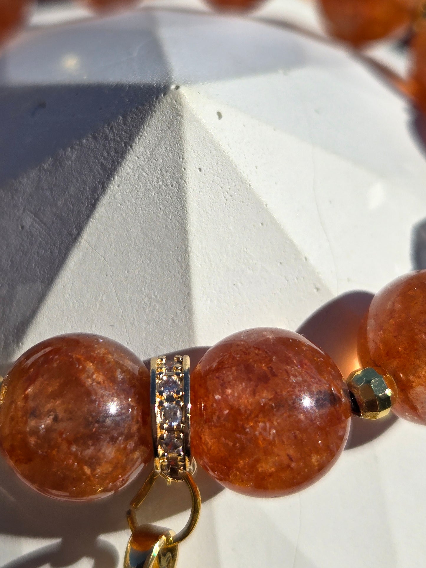 Orange Strawberry Quartz Bracelet with Fancy Dangle Charm and Gold-Tone Accents