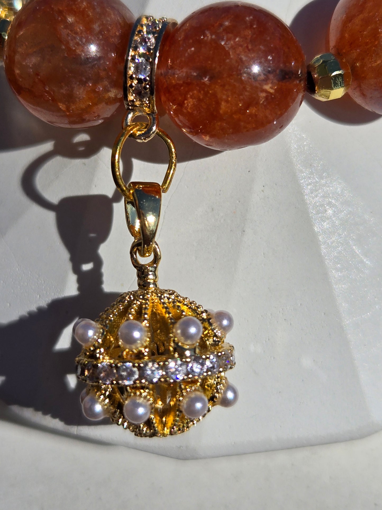 Orange Strawberry Quartz Bracelet with Fancy Dangle Charm and Gold-Tone Accents