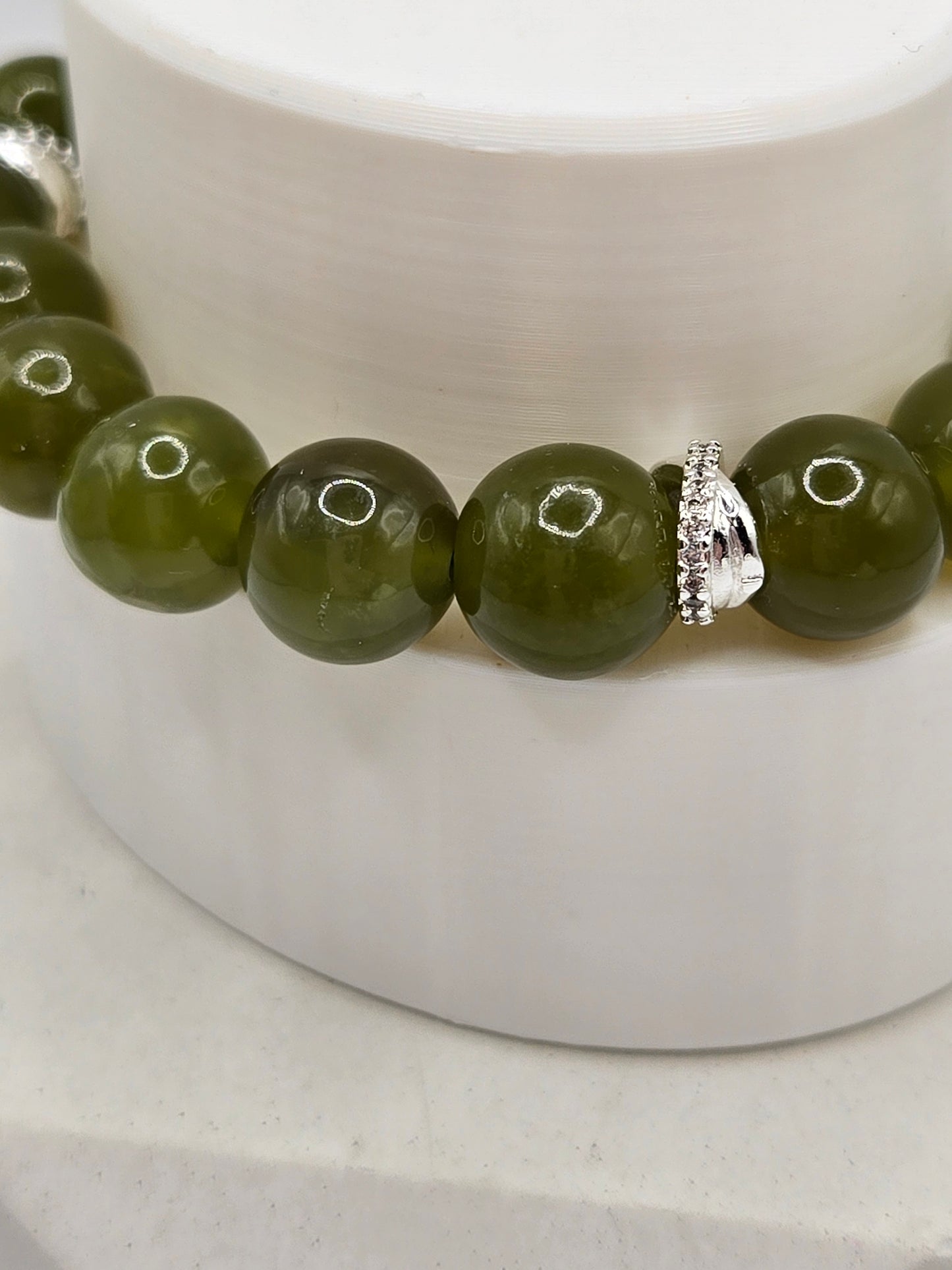 Olive Green Serpentine Bracelet with Sparkly Bow Charm – Elegant & Playful
